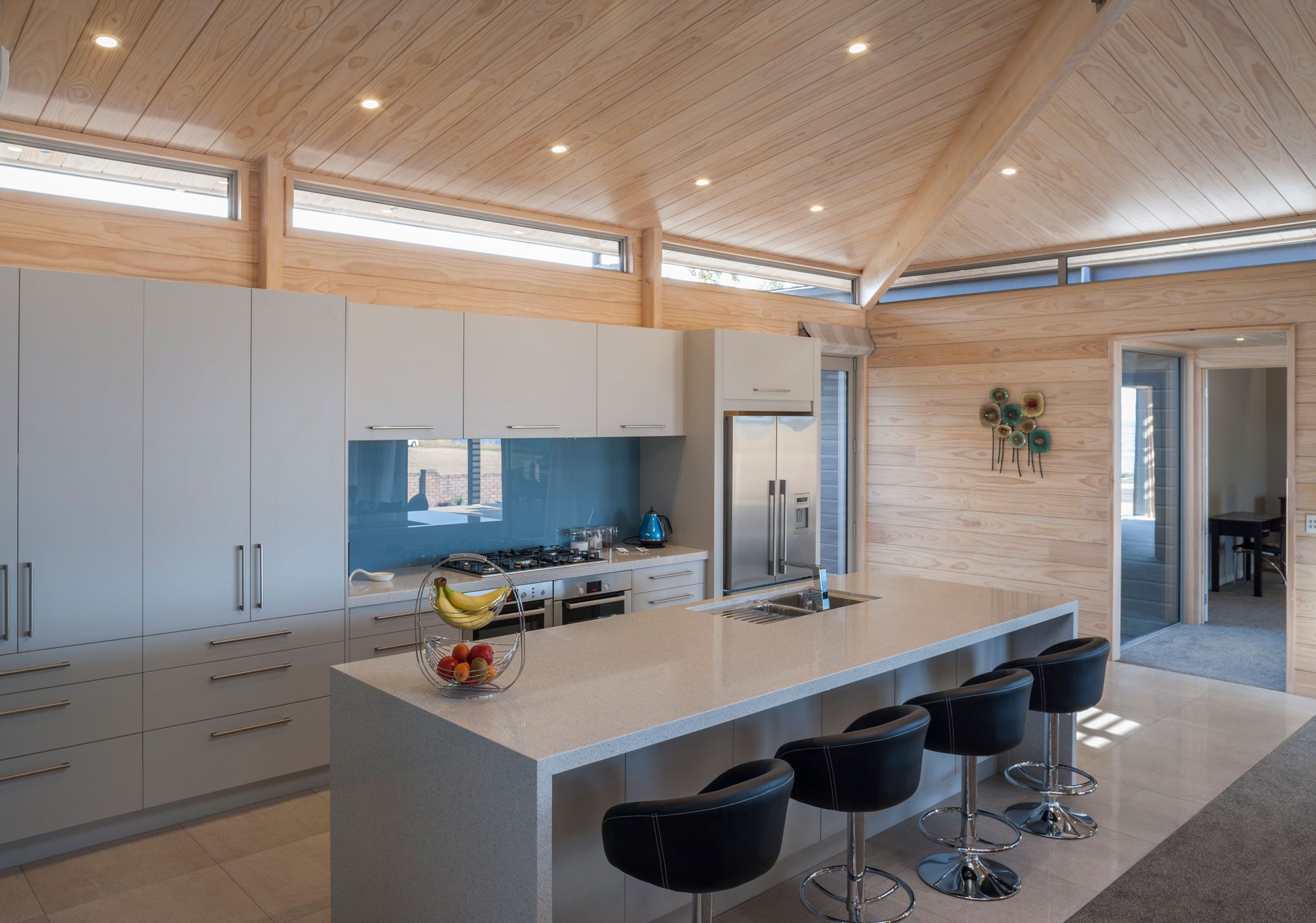 Calming blue splashback in Lakeside home