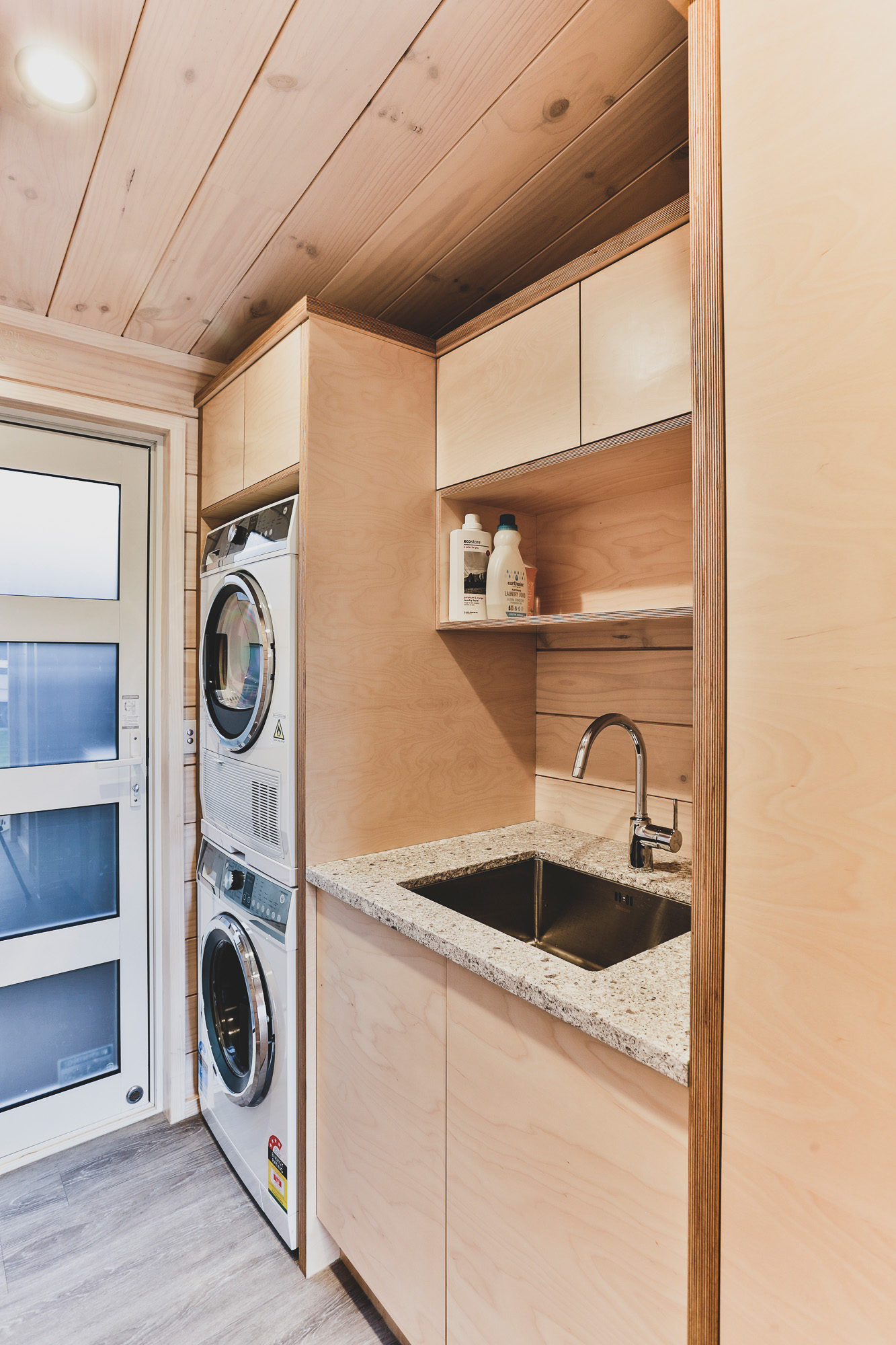 Lockwood home laundry with stacked washer and dryer