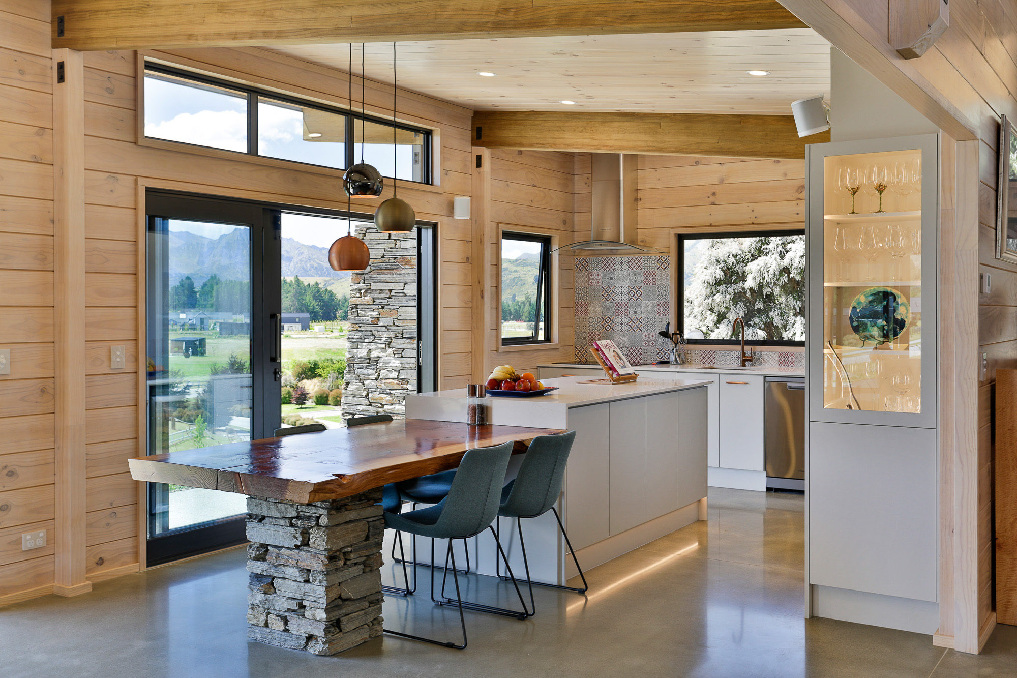 Integrated dining table with stone in Lockwood kitchen