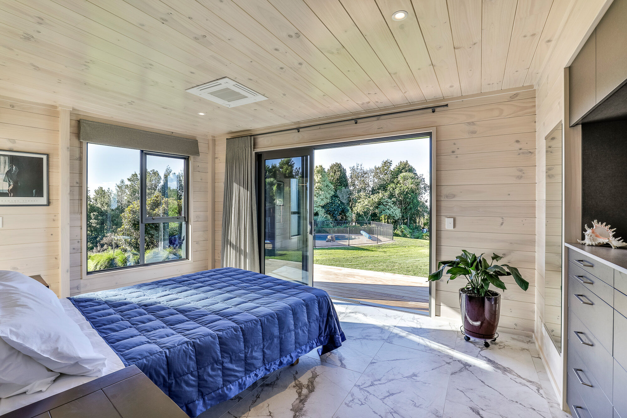 Naturally lit Lockwood room with deck access