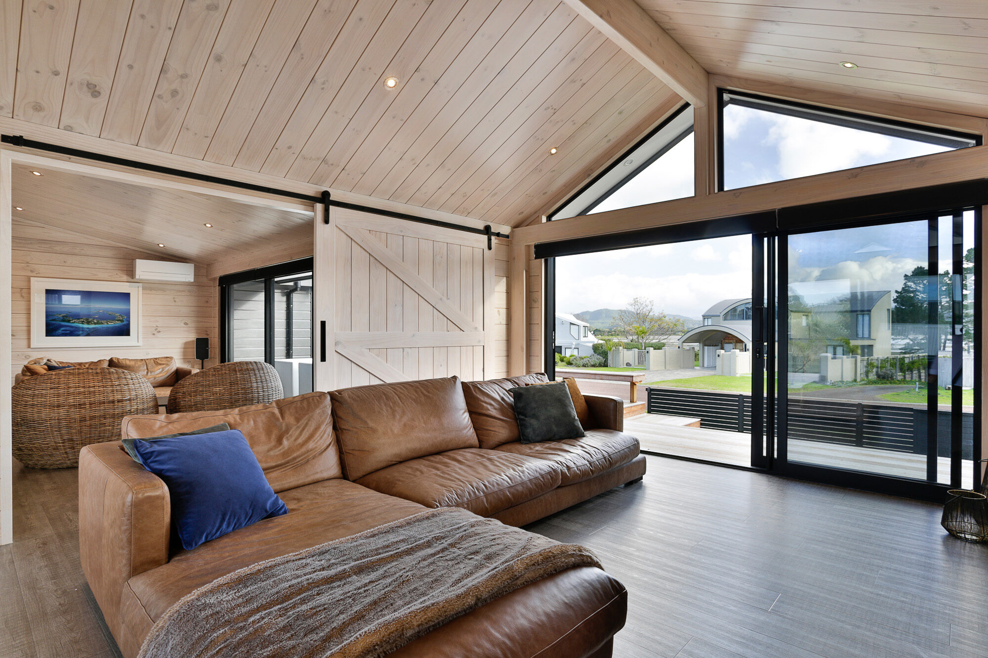Blonded barn doors help blend in with this neutral coloured home