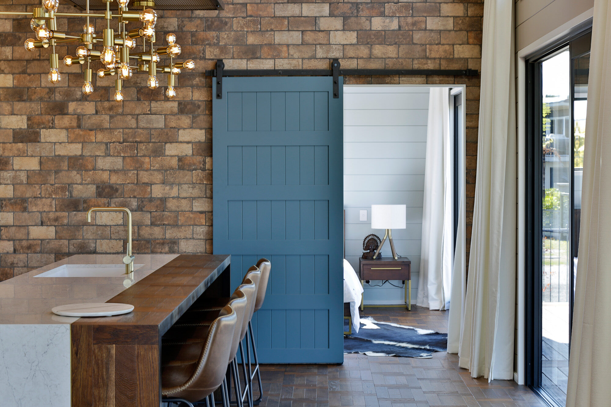 Master bedroom barn door gives a unique feel